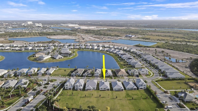 bird's eye view with a residential view and a water view