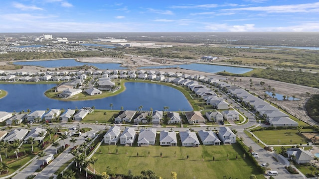 bird's eye view featuring a water view and a residential view