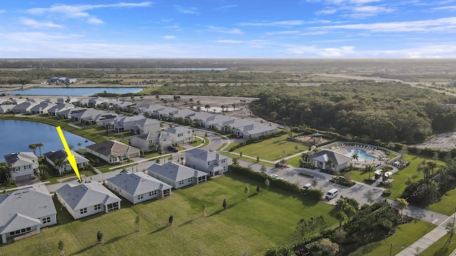 aerial view with a water view and a residential view