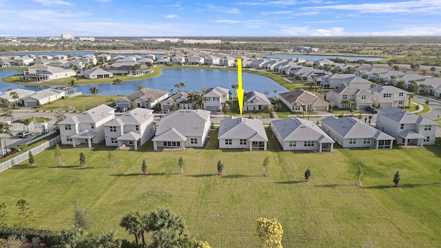 aerial view with a residential view and a water view