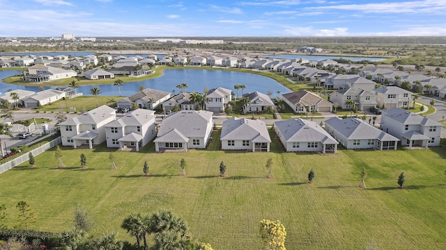 bird's eye view with a water view and a residential view