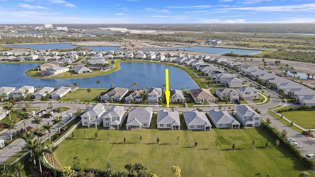 aerial view with a water view and a residential view