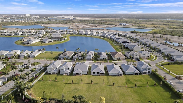 bird's eye view featuring a water view and a residential view