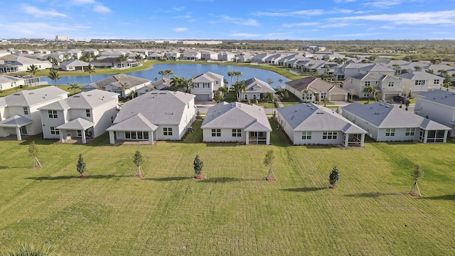 aerial view with a water view and a residential view