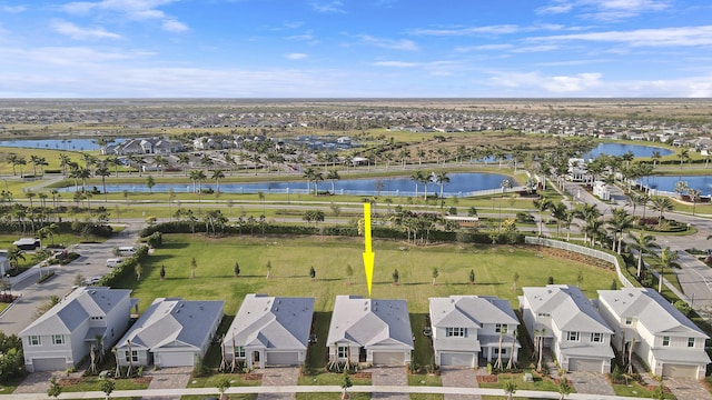 aerial view with a water view and a residential view