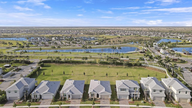 aerial view featuring a residential view and a water view