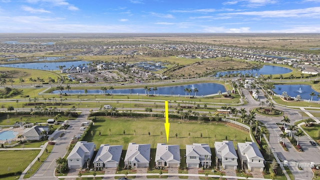 aerial view with a water view and a residential view