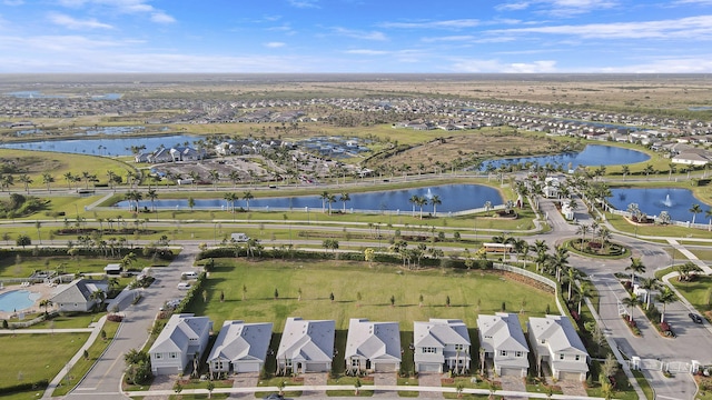 bird's eye view with a water view and a residential view