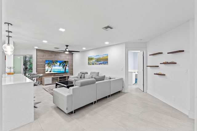 living area with ceiling fan, visible vents, baseboards, and recessed lighting