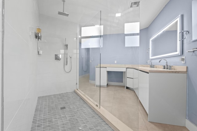 full bathroom featuring visible vents, walk in shower, vanity, and tile patterned floors