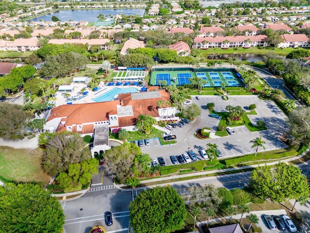 bird's eye view with a residential view and a water view