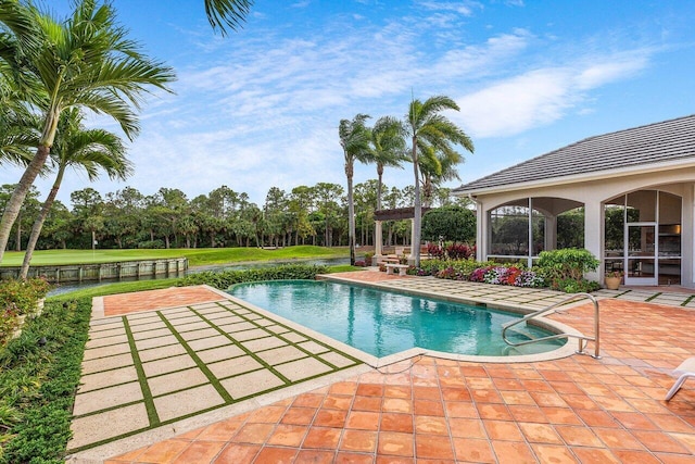 7500 Marsh Cv, Palm Beach Gardens, FL 33418 - outdoor pool with a patio area and view of scattered trees
