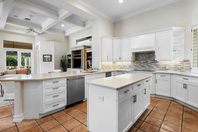 kitchen with open shelves, a kitchen island, a sink, dishwasher, and a peninsula