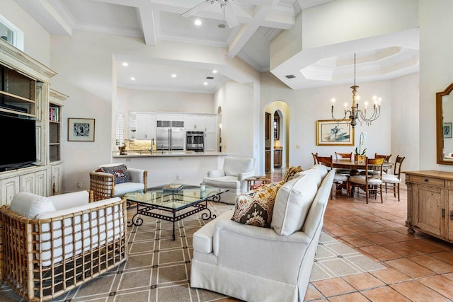 tiled living room with crown molding, arched walkways, beamed ceiling, and recessed lighting