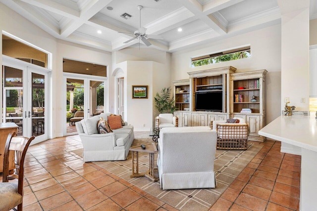 tiled living area with french doors, beamed ceiling, plenty of natural light, and a towering ceiling