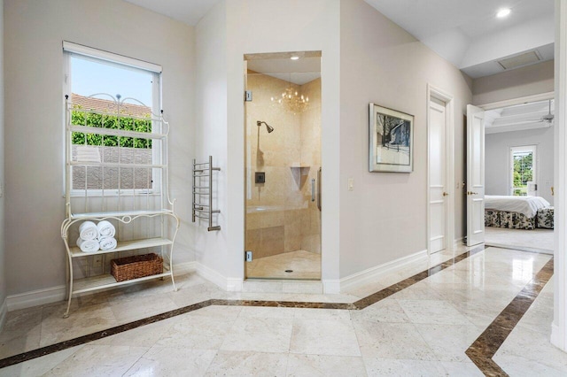 ensuite bathroom featuring baseboards, connected bathroom, marble finish floor, a shower stall, and recessed lighting