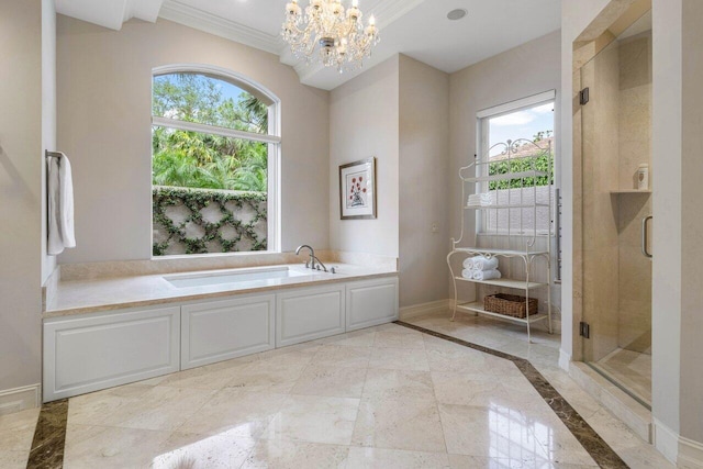 7500 Marsh Cv, Palm Beach Gardens, FL 33418 - bathroom featuring a garden tub, healthy amount of natural light, a chandelier, a stall shower, and crown molding