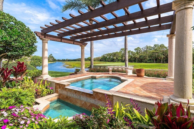 view of swimming pool with a lawn and an in ground hot tub