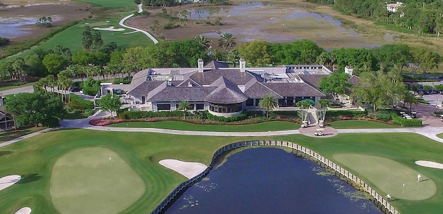 birds eye view of property featuring a water view and golf course view