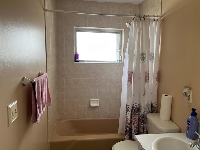 full bath featuring shower / bathtub combination with curtain, toilet, and vanity