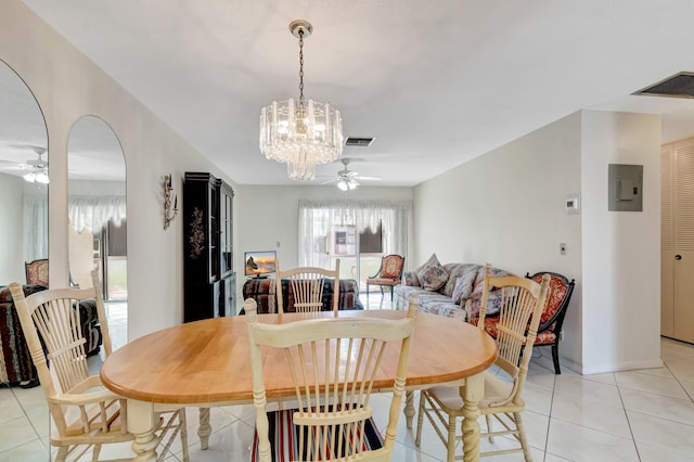 dining space featuring light tile patterned floors, arched walkways, ceiling fan with notable chandelier, visible vents, and electric panel