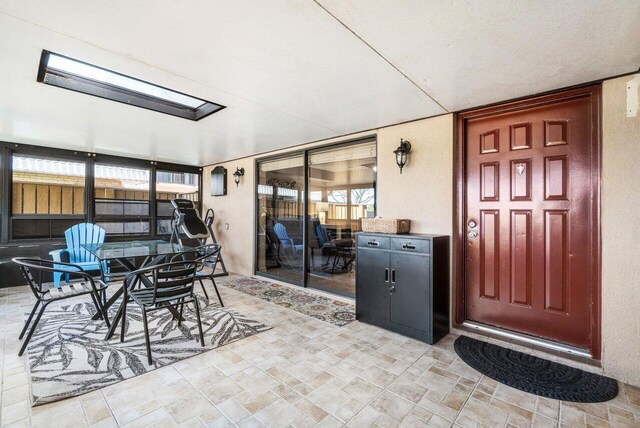 sunroom featuring a skylight