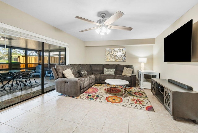 living area with a ceiling fan and light tile patterned floors