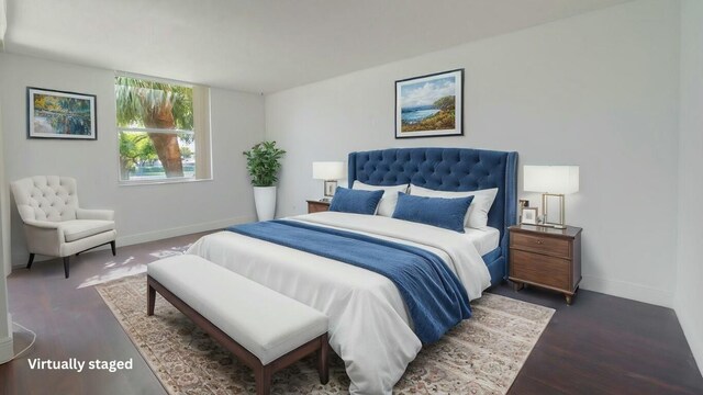 spare room featuring a textured ceiling, wood finished floors, visible vents, baseboards, and a wall of windows