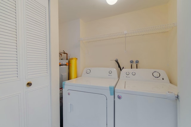 laundry area featuring laundry area and washer and clothes dryer