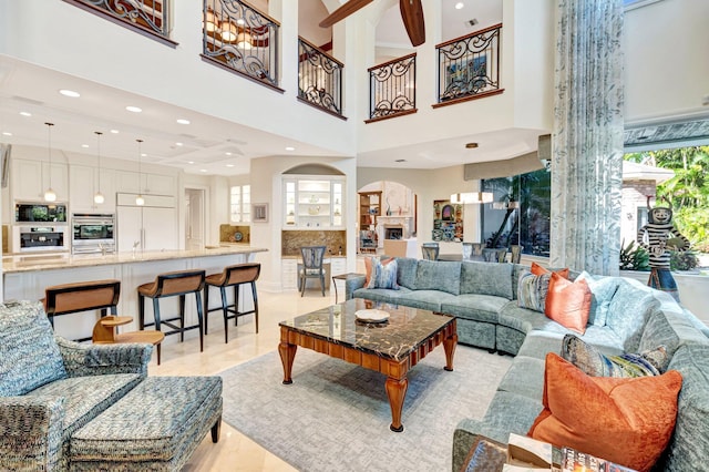 living area featuring recessed lighting and visible vents