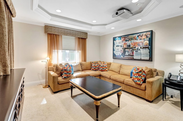 living area with a raised ceiling, light colored carpet, and ornamental molding
