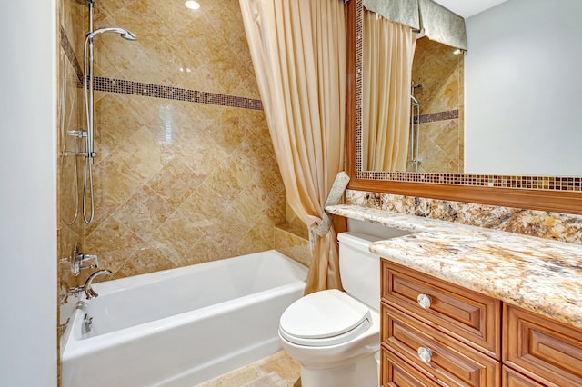 bathroom featuring vanity, toilet, and shower / tub combo
