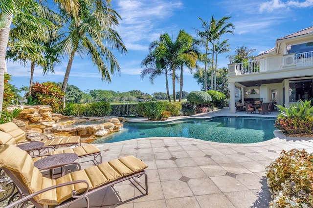 outdoor pool with a patio