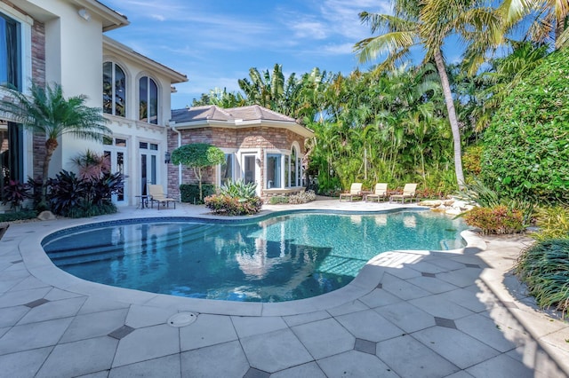 pool with a patio area