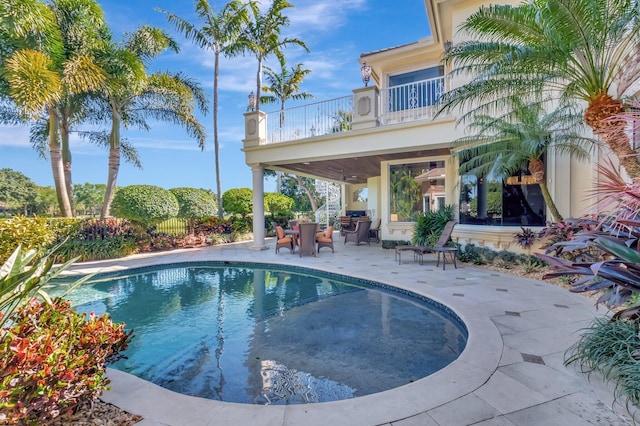 pool with a patio area