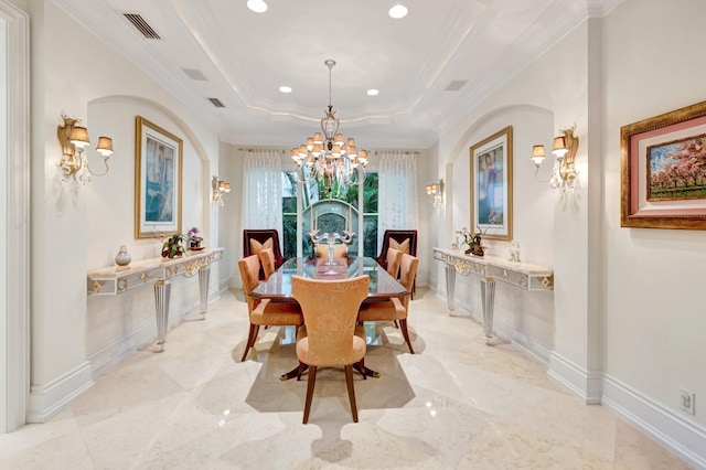 dining room with visible vents, baseboards, a tray ceiling, crown molding, and a notable chandelier