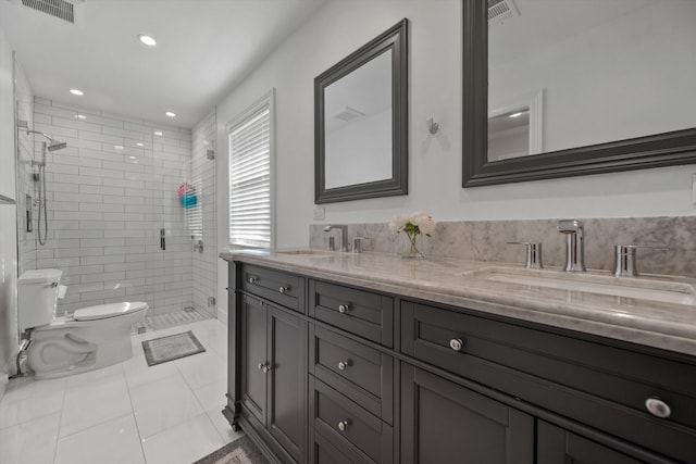 full bath featuring toilet, visible vents, and a sink