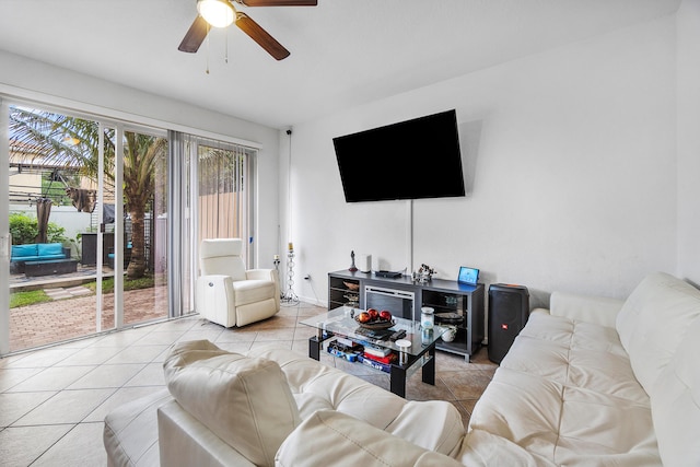 tiled living room with a ceiling fan