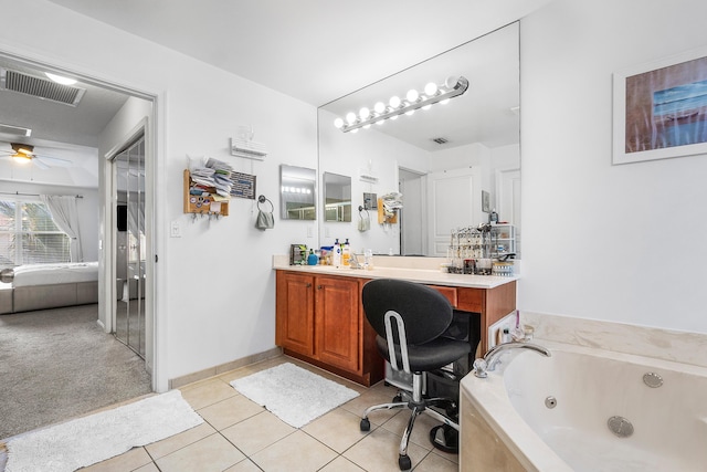 ensuite bathroom featuring visible vents, ensuite bath, a tub with jets, tile patterned flooring, and vanity