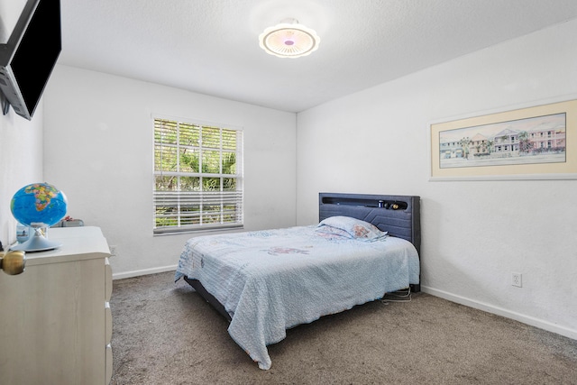 carpeted bedroom with baseboards