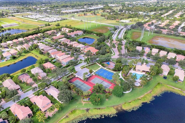 bird's eye view with a water view and a residential view