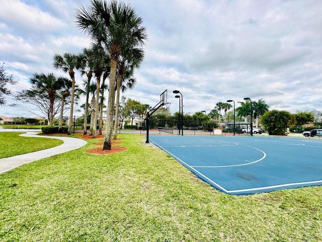 view of sport court featuring community basketball court and a lawn