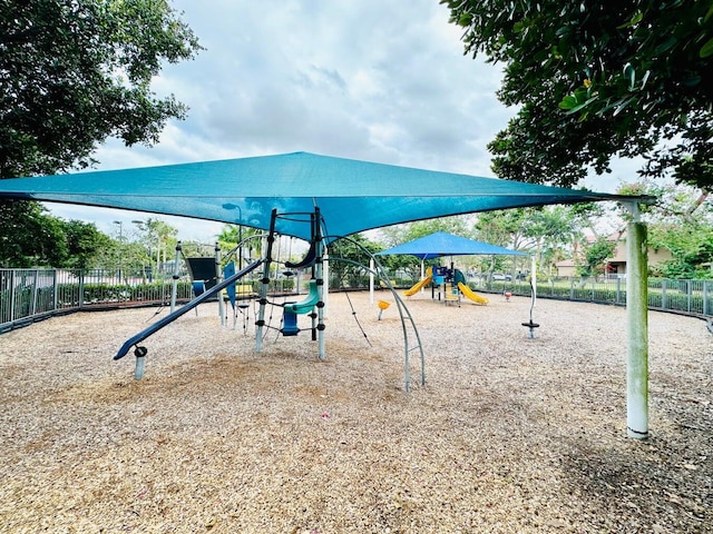 communal playground featuring fence