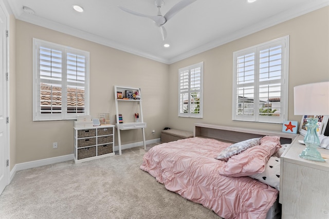 bedroom with ornamental molding, carpet flooring, and baseboards