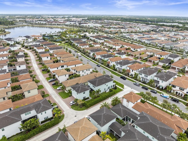 birds eye view of property featuring a residential view and a water view