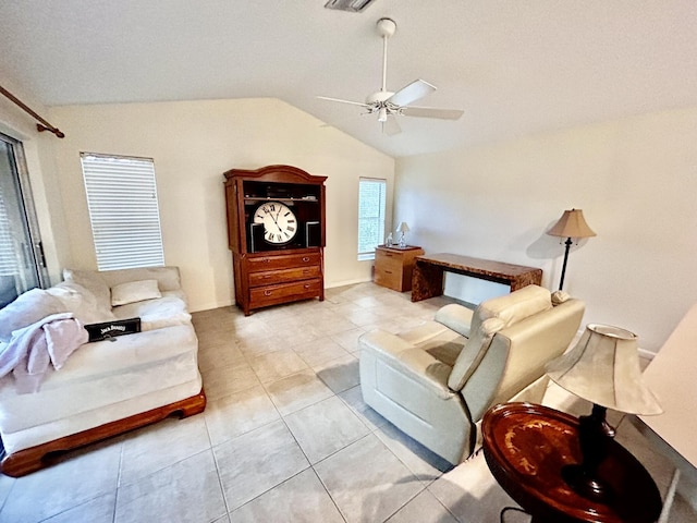 living room featuring vaulted ceiling, ceiling fan, and light tile patterned flooring