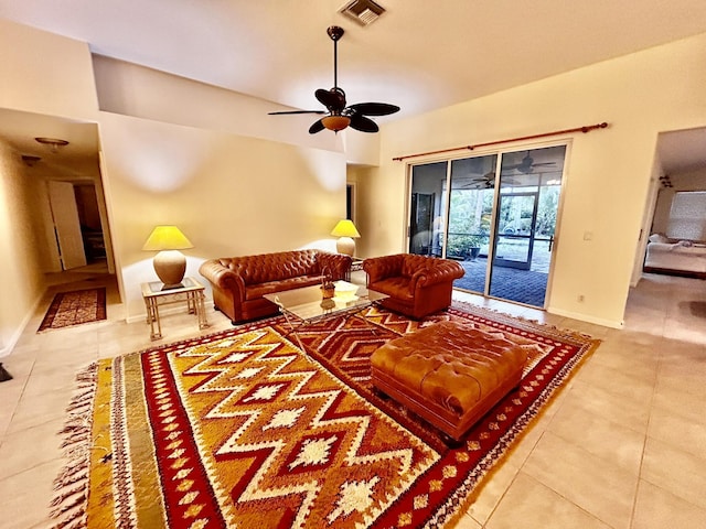 living room with visible vents, ceiling fan, baseboards, and tile patterned floors