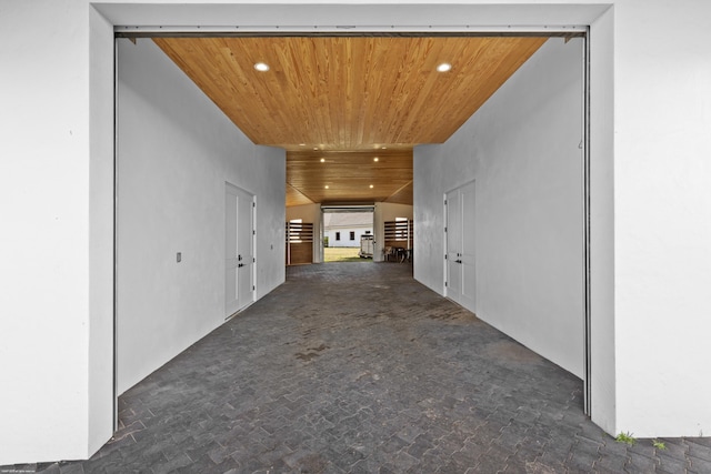 corridor featuring recessed lighting and wood ceiling