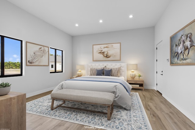 bedroom featuring recessed lighting, light wood-style flooring, and baseboards