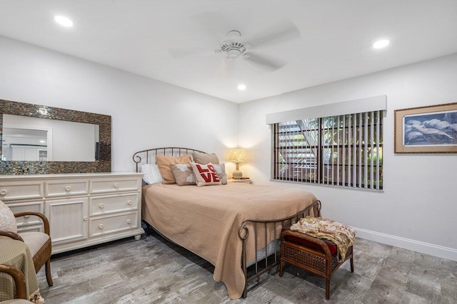 bedroom featuring light wood-style flooring, baseboards, and recessed lighting